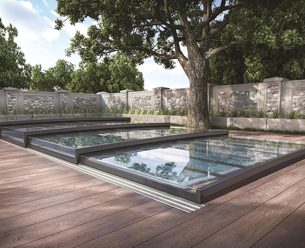 Low-profile horizontal pool enclosure in a landscaped garden