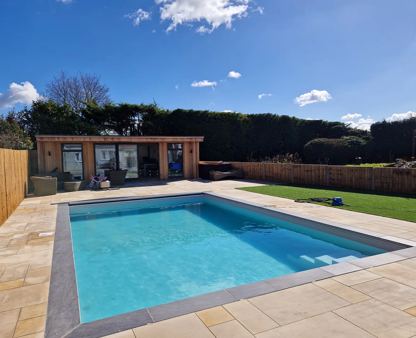 Outdoor pool with decking and countryside views